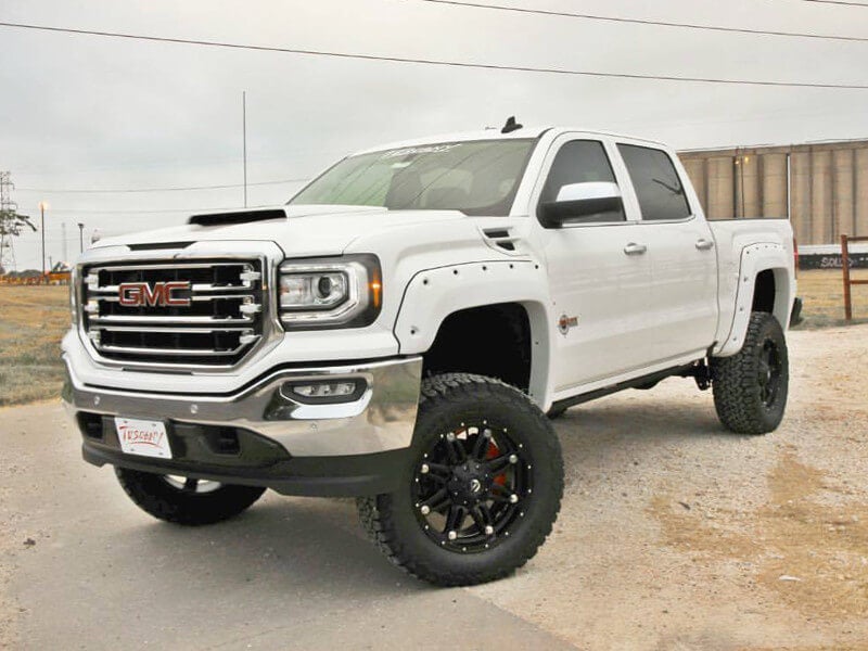 White GMC lifted truck