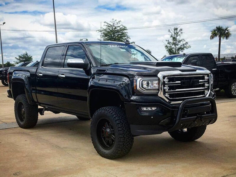 Black GMC lifted truck