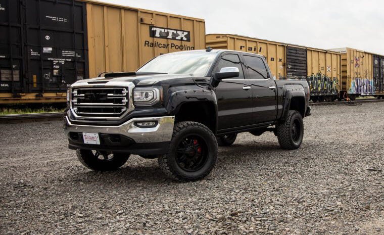 Black GMC lifted truck with badlander package