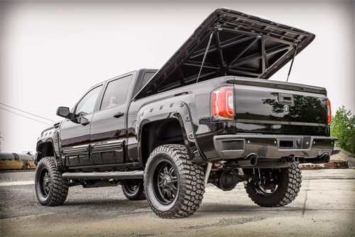White GMC lifted truck
