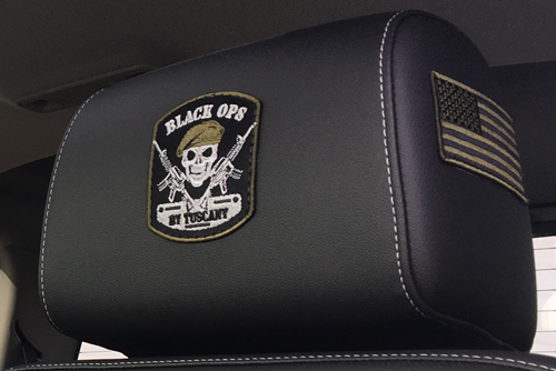 front view of red GMC lifted truck