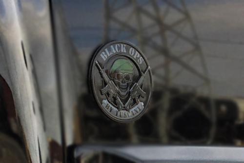 front view of red GMC lifted truck