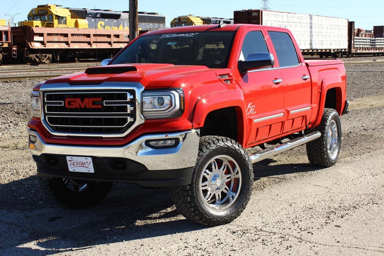 Red GMC lifted truck